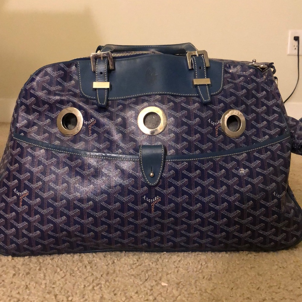 Blue leather Goyard pet travel bag.